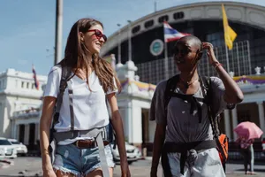 Two women travelers enjoying a sunny day exploring a new city. jigsaw puzzle