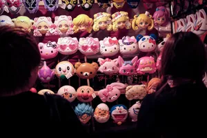Colorful anime masks for sale at a bustling Tokyo market stall, Japan. jigsaw puzzle