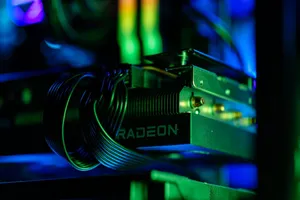 Detailed close-up of a gaming PC's Radeon graphics card with vibrant RGB lighting, showcasing cables and hardware. jigsaw puzzle