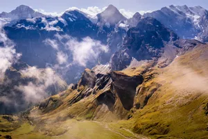 Breathtaking aerial shot of the magnificent Lauterbrunnen mountains in Switzerland with floating clouds. jigsaw puzzle