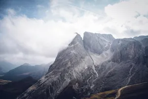 Stunning view of rocky mountain peaks enveloped in clouds, showcasing nature's grandeur. jigsaw puzzle