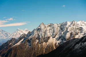 Stunning view of snow-capped Himalayan peaks against a clear blue sky in Nepal. jigsaw puzzle
