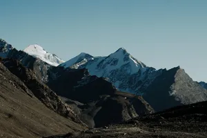 Captivating view of snow-covered Himalayan mountains against a clear morning sky. jigsaw puzzle