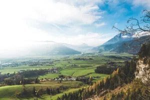 Stunning view of a lush valley with mountains, perfect for nature lovers. jigsaw puzzle