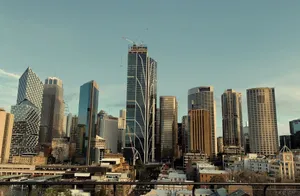 A stunning view of Sydney's skyline featuring modern skyscrapers and iconic architecture under a blue sky. jigsaw puzzle
