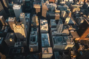 Aerial shot of skyscrapers in a city with sunlight casting shadows. jigsaw puzzle