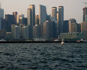 Stunning view of Toronto's modern skyline with Lake Ontario in the foreground at dusk. jigsaw puzzle