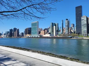 A clear day view of New York City skyline from across the river, showcasing iconic skyscrapers. jigsaw puzzle