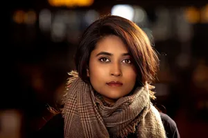 Elegant portrait of a woman wearing a plaid scarf, showcasing natural beauty and fashion. jigsaw puzzle