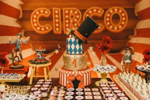 Decorated tiered cake with sweet desserts served on table with colorful decorations in theme of circus jigsaw puzzle