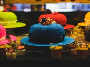 Vibrant display of assorted colorful cakes and desserts, perfect for celebrations. jigsaw puzzle