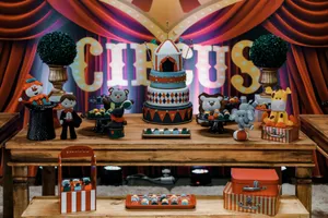 Vibrant circus-themed dessert table with cakes and pastries, perfect for parties. jigsaw puzzle