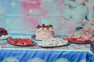 Vibrant dessert table featuring a cake with strawberries and assorted sweets, perfect for celebrations. jigsaw puzzle