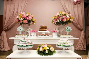 A beautifully decorated dessert table with floral arrangements, cakes, and pastries, perfect for celebrations. jigsaw puzzle