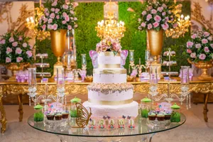 Luxurious quinceañera setup with a grand cake, florals, and upscale decor in a vibrant setting. jigsaw puzzle