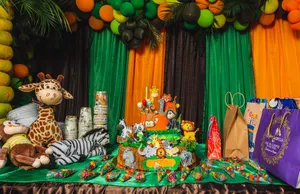 Vibrant safari-themed birthday setup with cake, decorations, and gifts indoors. jigsaw puzzle