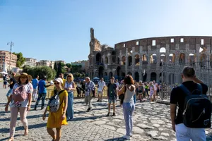 Tourists wander around the iconic Colosseum in Rome on a clear summer day, capturing memories. jigsaw puzzle