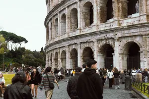 Crowds of tourists gather around the iconic Colosseum in Rome, Italy, capturing its historic essence. jigsaw puzzle