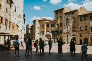 Tourists gather at the medieval Piazza della Cisterna in San Gimignano, Tuscany, Italy. jigsaw puzzle