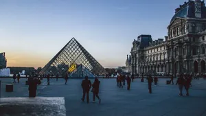 Evening view of Louvre Pyramid surrounded by visitors in Paris. jigsaw puzzle
