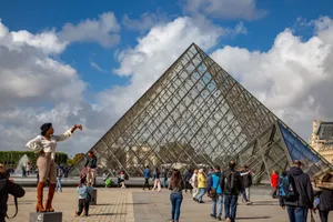 People enjoying a sunny day at the Louvre Pyramid in Paris, France. jigsaw puzzle
