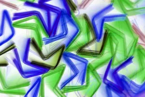 Vibrant abstract illustration with overlapping geometric patterns in blue and green, creating a dynamic visual effect. jigsaw puzzle