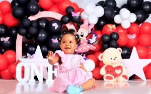 Cute baby girl celebrating first birthday with colorful balloons and teddy bear. jigsaw puzzle