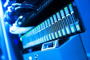 A detailed view of a blue lit computer server rack in a data center showcasing technology and hardware. jigsaw puzzle
