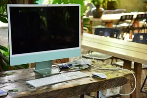 Modern computer setup on a rustic table outdoors, perfect for remote work. jigsaw puzzle