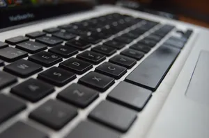 Detailed close-up of a laptop keyboard showcasing technology and productivity aspects. jigsaw puzzle