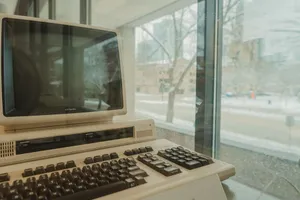 A vintage Epson computer displayed indoors against a snowy window view in Milwaukee during winter. jigsaw puzzle