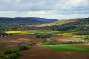 Aerial view of rolling hills and green fields in Nagygörbő, Hungary, showcasing pastoral beauty and tranquility. jigsaw puzzle