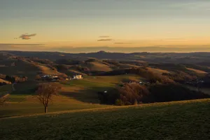Peaceful countryside hills with houses and trees during a beautiful sunset. jigsaw puzzle
