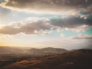 Beautiful panoramic view of Amman's mountain ranges under a vibrant sunset sky. jigsaw puzzle