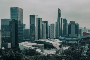 A modern urban skyline featuring numerous skyscrapers under a gloomy sky. jigsaw puzzle