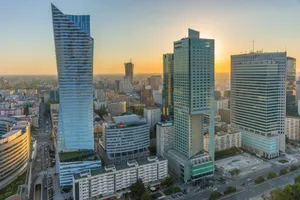 Aerial view of modern skyscrapers in Warsaw at sunset, showcasing the city's urban skyline. jigsaw puzzle
