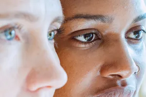 A close-up view highlighting the diverse skin tones and facial features of two women, showcasing beauty and diversity. jigsaw puzzle