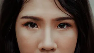 A detailed close-up image showcasing the expressive eyes and natural beauty of a young woman. jigsaw puzzle