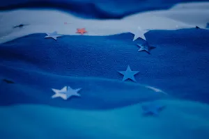 Blue fabric with scattered star shapes creating abstract visual patterns. jigsaw puzzle