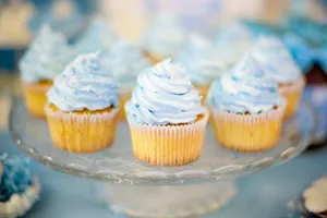 Close-up of mouthwatering cupcakes with blue icing, perfect for celebrations and parties. jigsaw puzzle