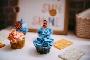 Colorful cupcakes with blue and orange frosting topped with playful decor, perfect for celebrations. jigsaw puzzle