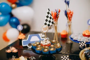 A vibrant racing-themed birthday table with sweets and decorations perfect for a child turning two. jigsaw puzzle