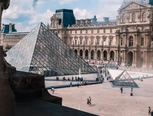 View of the Louvre Museum and iconic glass pyramid in Paris, a top tourist destination. jigsaw puzzle
