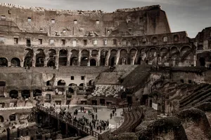 Explore the ancient Roman Colosseum's interior ruins with tourists capturing its timeless architecture. jigsaw puzzle