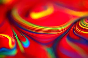 Close-up of vibrant swirls in red and rainbow colors, creating an abstract pattern. jigsaw puzzle