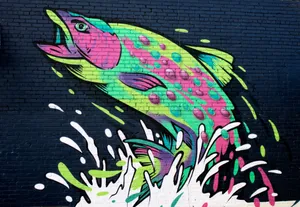 Colorful street art mural of a fish splashing on a brick wall in Asheville, NC. jigsaw puzzle