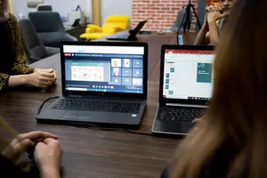Team discusses projects during a virtual and in-person meeting in a Dubai office. jigsaw puzzle