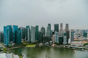 Aerial shot showcasing the modern skyline of Singapore with Marina Bay in the foreground, capturing urban architecture and water scenery. jigsaw puzzle