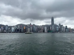 Dramatic view of Hong Kong skyline with cloudy skies over Victoria Harbour. jigsaw puzzle
