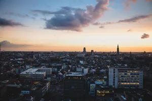 A stunning aerial view of Antwerp, Belgium, cityscape at dusk with vibrant sky colors. jigsaw puzzle